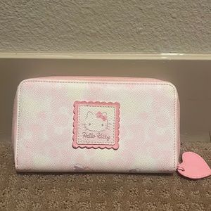 Pink hello kitty wallet.